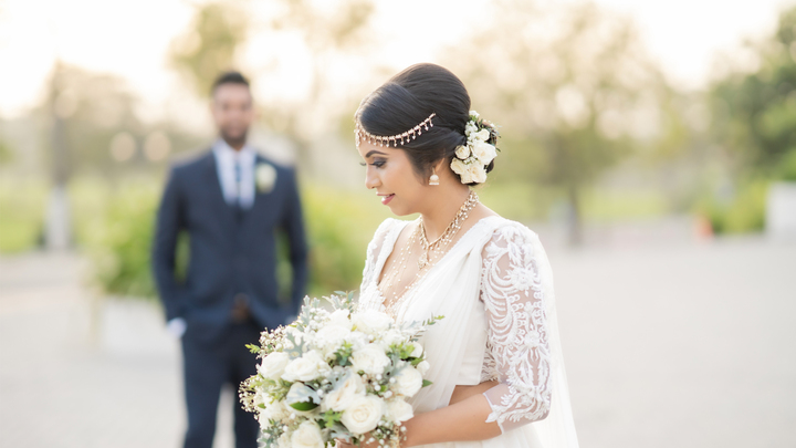 The groom looks at the bride from a distance on their wedding day, filled with love and happiness,sri lanka marriage proposal sites, sri lankan matrimony, marriage proposal in sri lanka, mangala yojana, sl marriage proposals, matrimony sri lanka, mangala yojana 2024