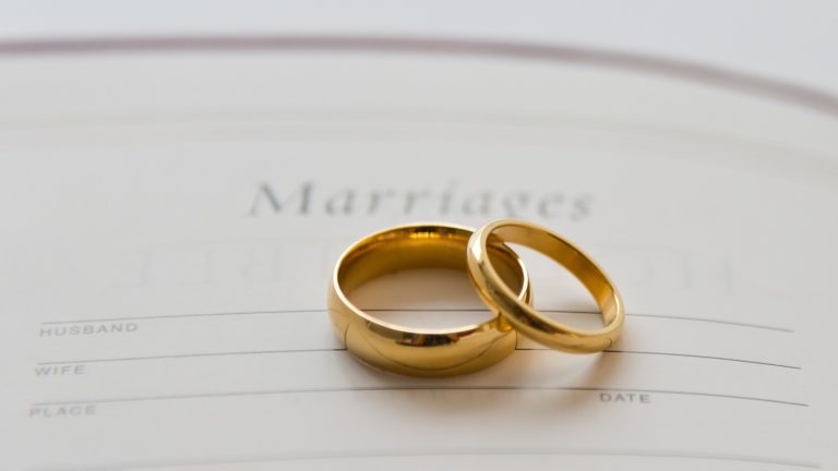 Two gold wedding rings resting on a marriage certificate, symbolizing union while exploring mangala yojana traditions, marriage proposals in Sri Lanka, matrimony Sri Lanka services, Poruwa.lk | ශ්‍රීලංකීය මංගල යෝජනා, Poruwa ceremony planning, Liyathabara marriage proposals, LankaMatrimony, Catholic marriage proposals, Hitad marriage proposals, Purahanda LK, Buddhist matrimony, and connections for Lanka brides and grooms.